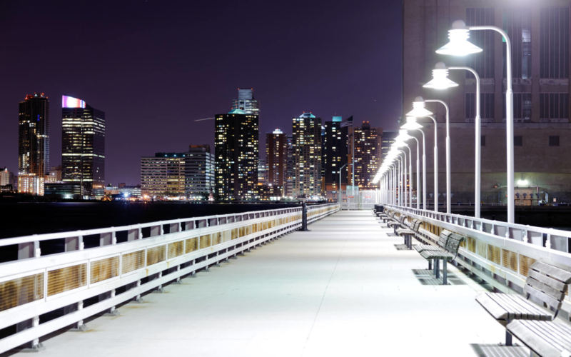 Night bridge with lanterns and benches in Night New York